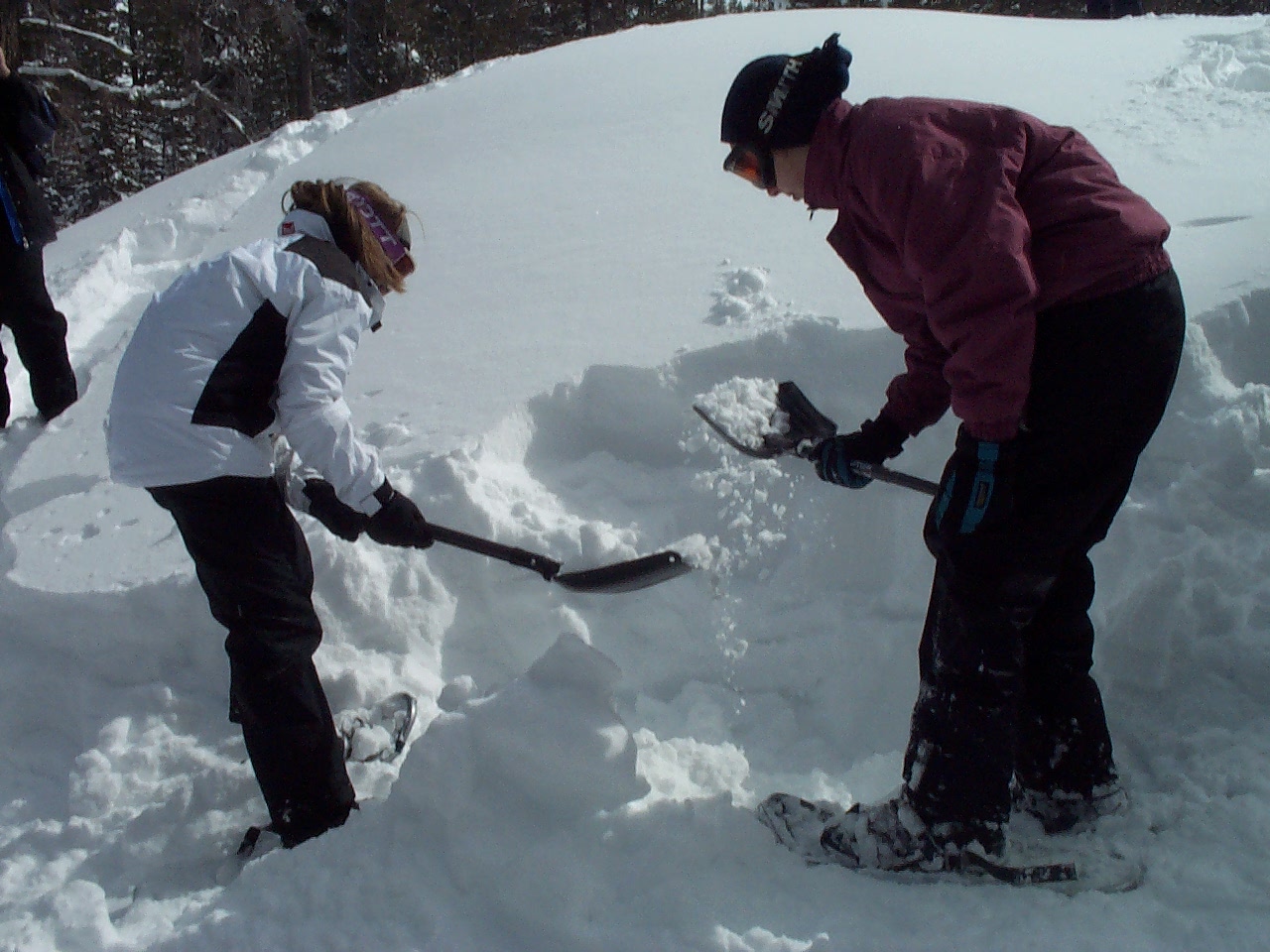 Keep digging straight down so you have a place to stand when you dig into the hill.