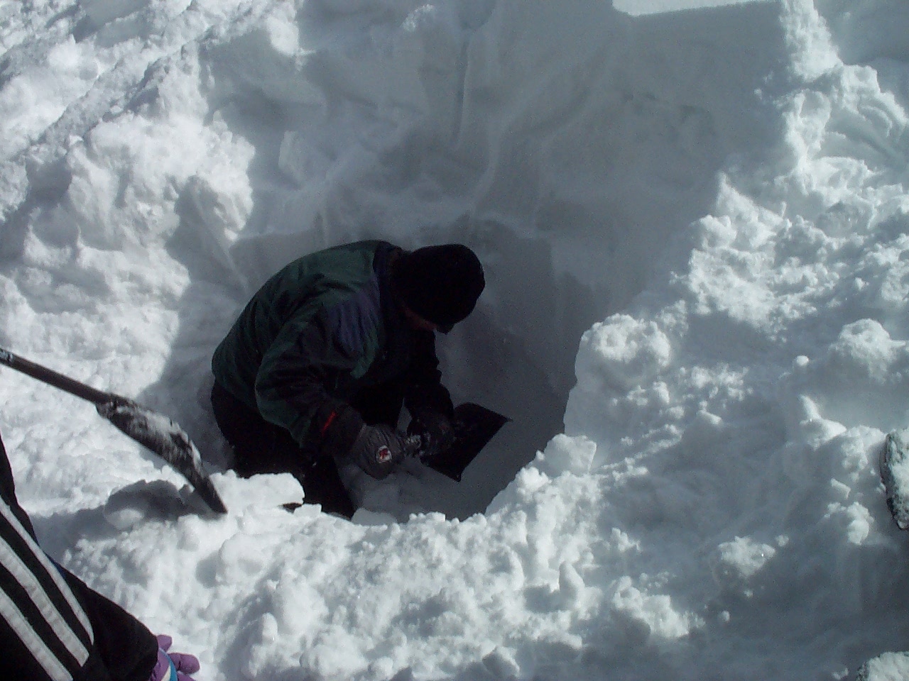Dig a space that is wide enough for your body and the shovel.