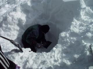 Dig a space that is wide enough for your body and the shovel.