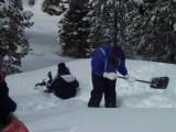Have someone else remove the snow from the pile you made while digging.