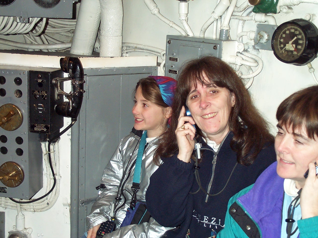 They provides us with listening devices.  You hold it up to your ear and hear the story of the submarine.