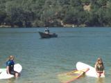 The life guard in a boat can lend a hand.